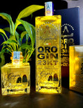 	Oro Gin 23 kt gin premium con scaglie d’oro
	•	Bottiglia Oro Gin 23 kt elegante con oro 23 carati
	•	Gin Oro 23 kt detalle etichetta bottiglia